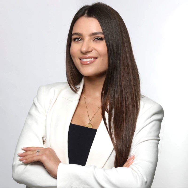 Natalia Kabajah, founder and CEO of RiseWiz, working at her desk